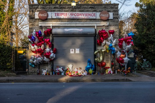 A memorial continues to grow in size outside of the Triple C Convenience store on Lindenwood Avenue in Norfolk on Friday, Dec. 22, 2023 after the store owner, 84-year-old James Carter, was killed due to gun violence on Wednesday night. (Kendall Warner / APP)