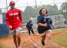 Cape Henry Collegiate baseball players volunteer at the Great Neck Baseball League's Champions League, which provides the opportunity for children with special needs to play baseball. 